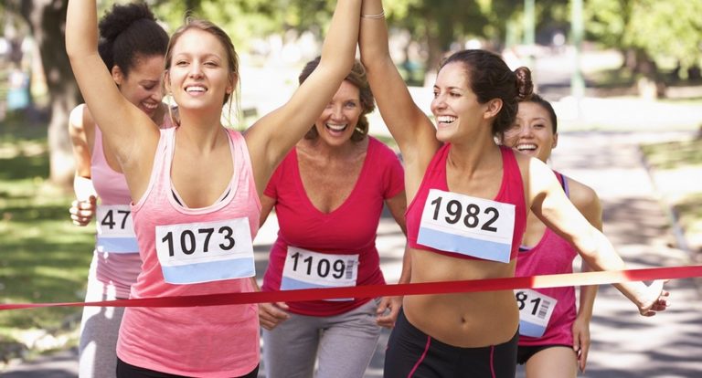 Millenial runners crossing the finish line
