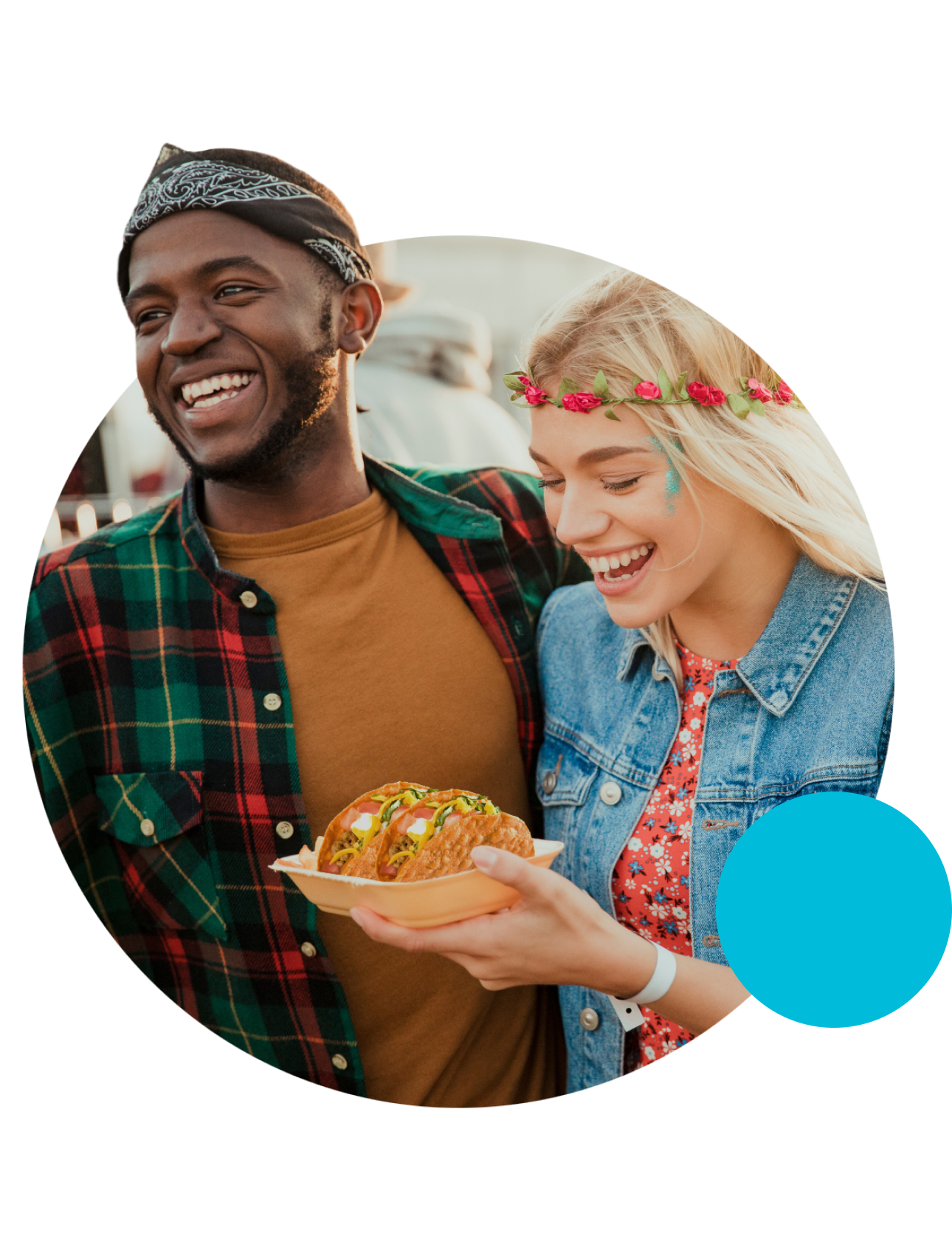 Couple eating tacos at an outdoor festival